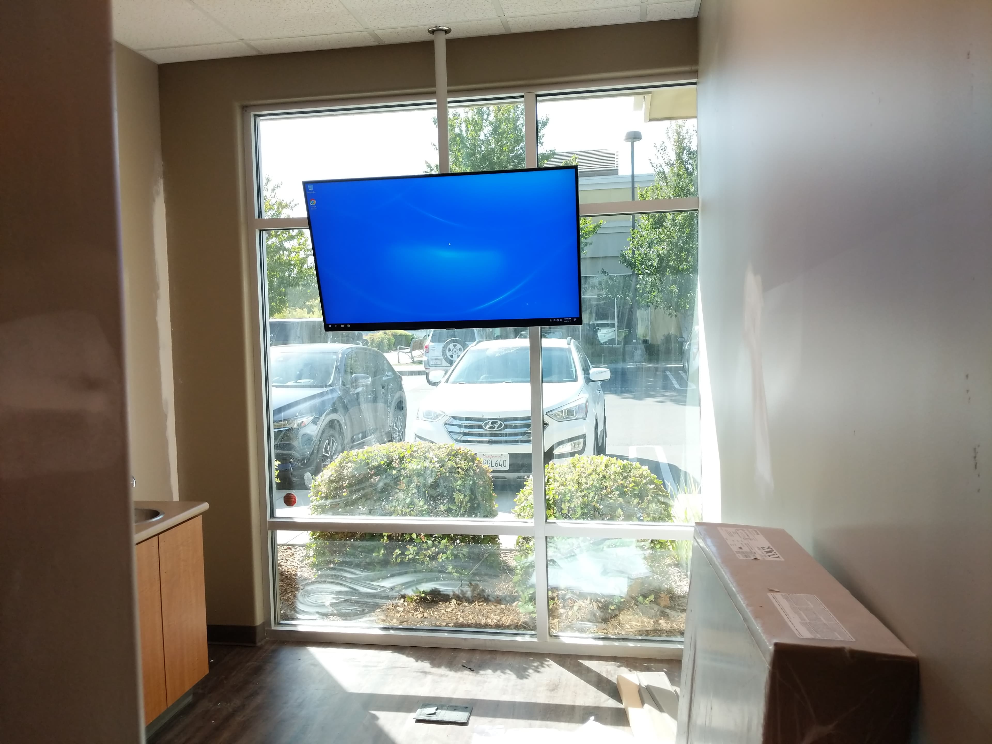 TV on ceiling pole mount in commercial space in Roseville, CA