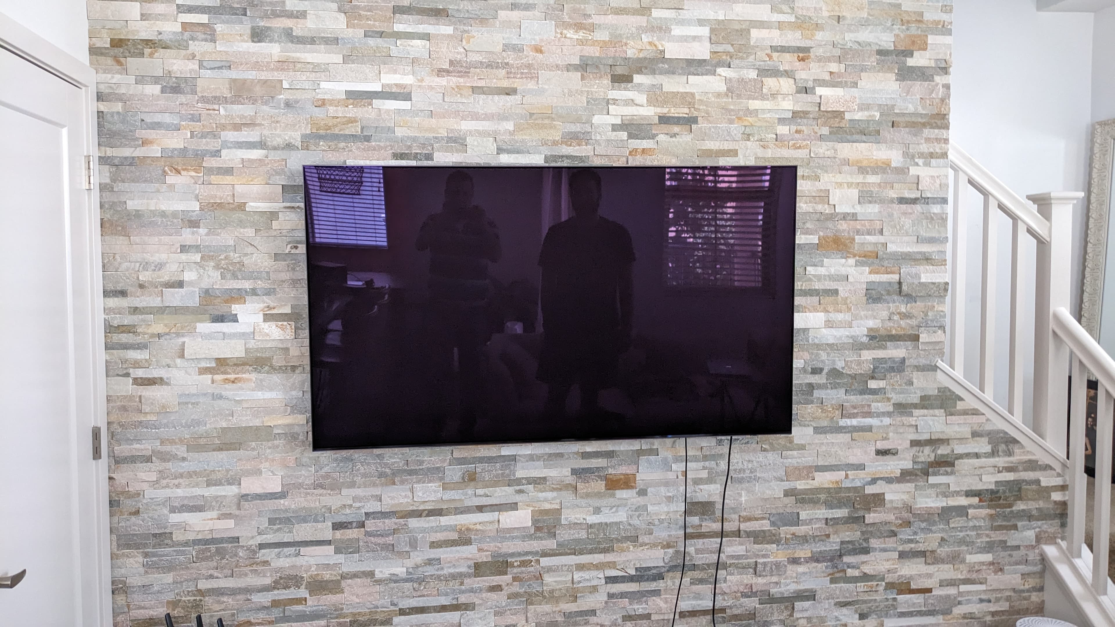 TV mounted on stacked stone accent wall in West Sacramento, CA