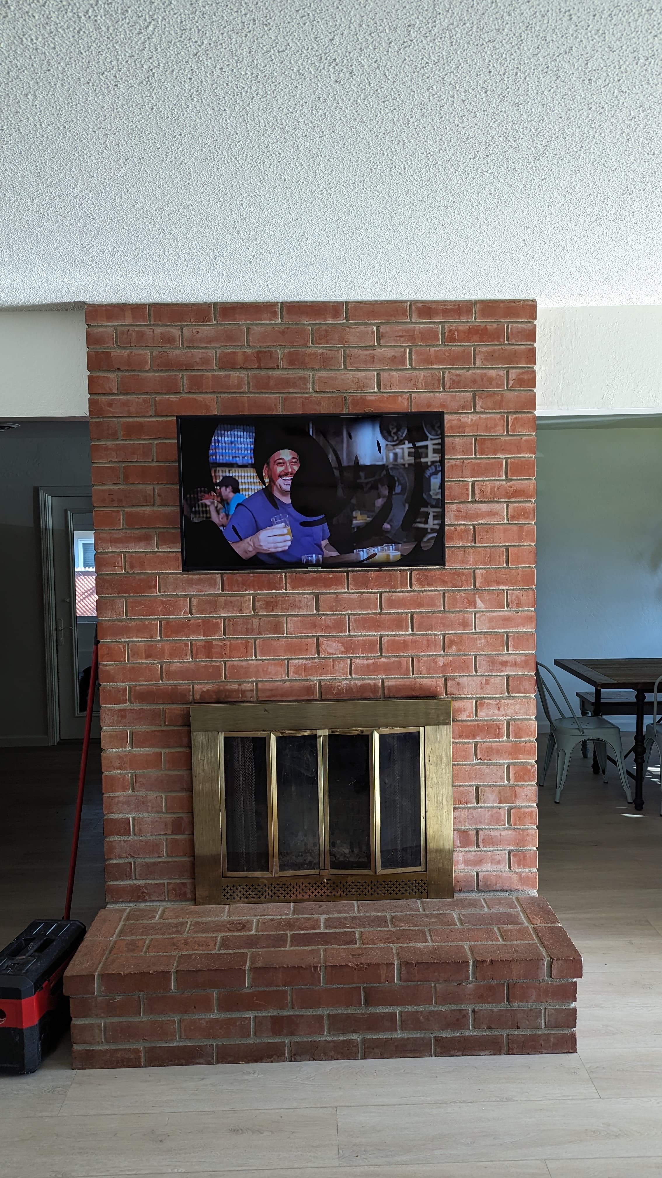 TV mounted on brick fireplace in Orangevale, CA