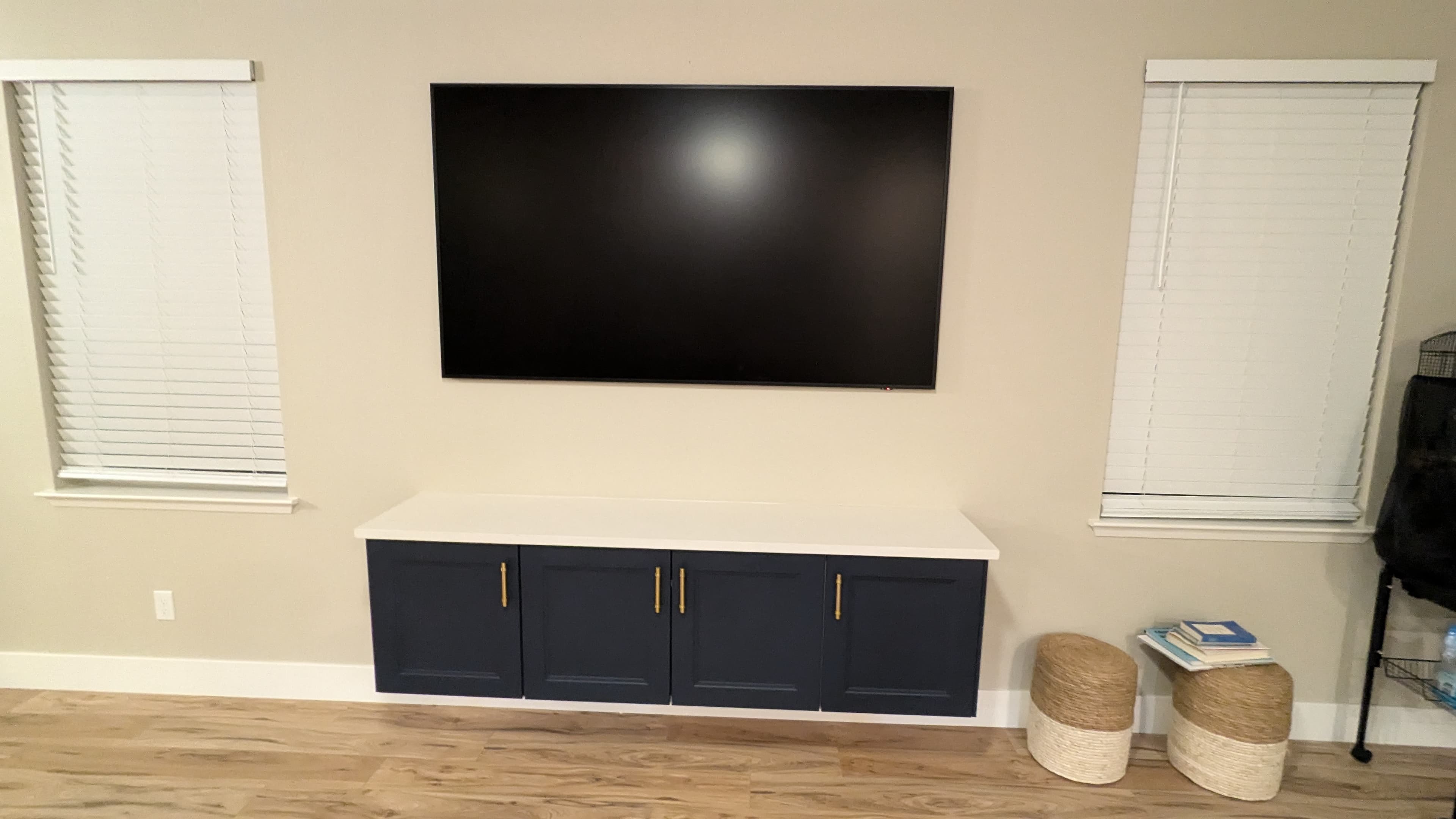Samsung Frame TV above navy floating cabinet in West Sacramento, CA