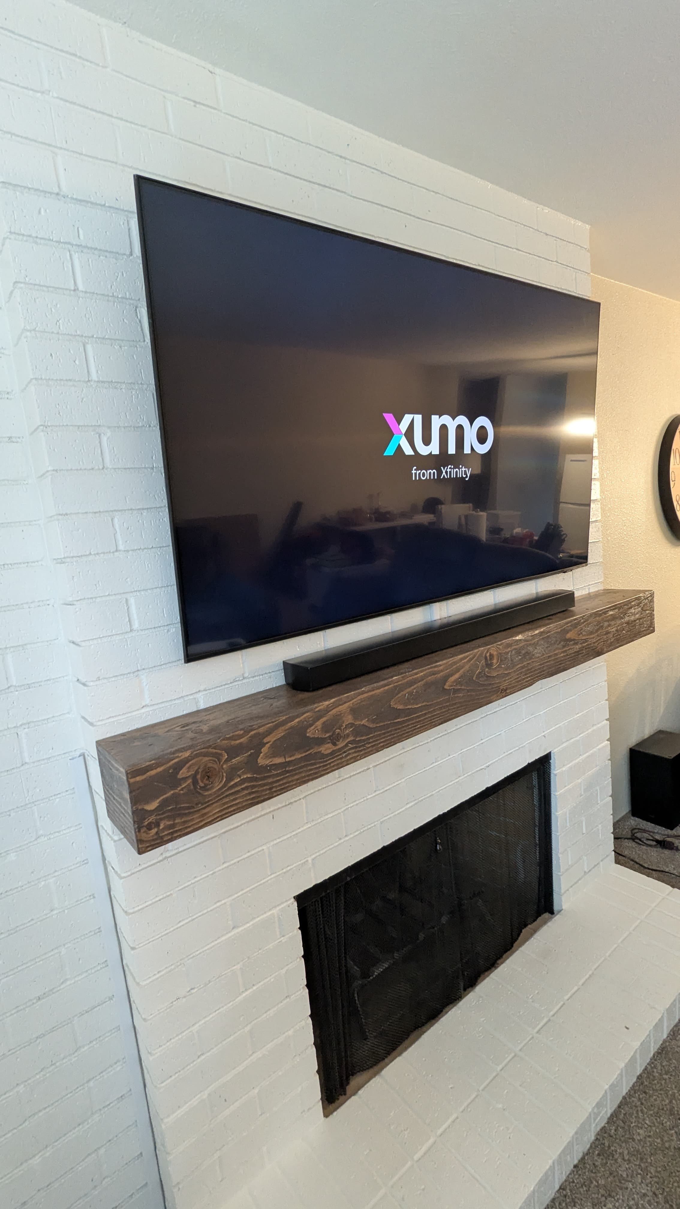 TV and soundbar on white painted brick fireplace in Sacramento, CA