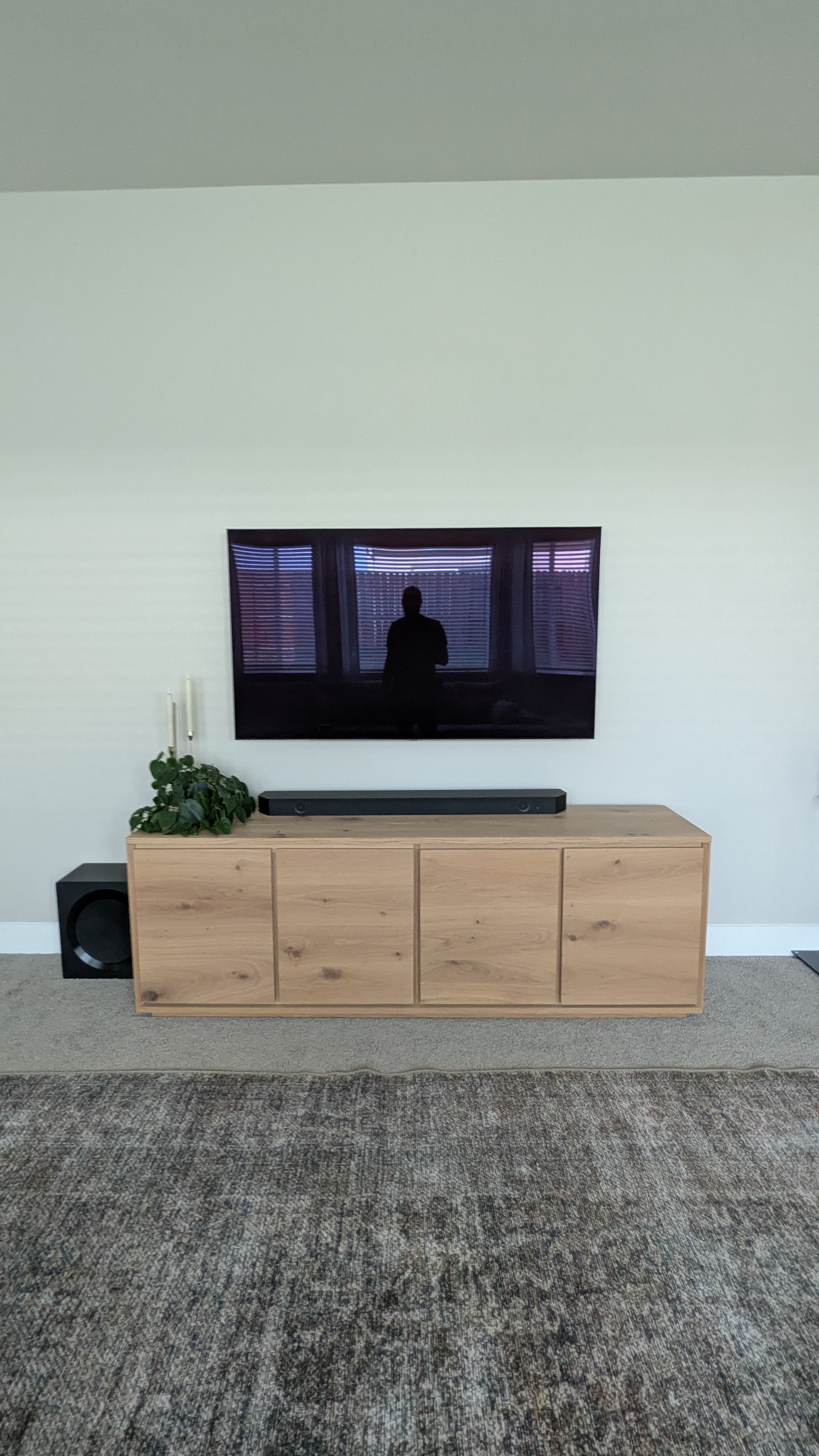 TV with soundbar above oak console in Fair Oaks, CA