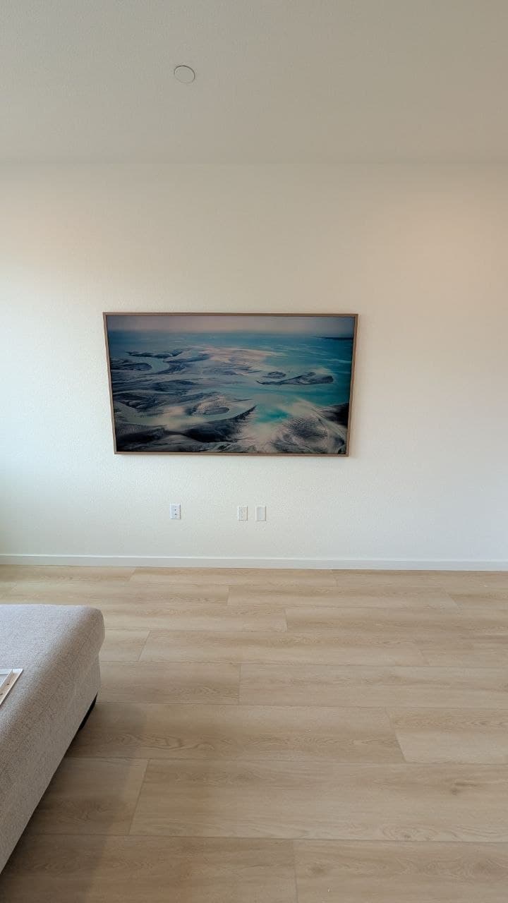 Samsung Frame Pro mounted on white wall in Elk Grove living room