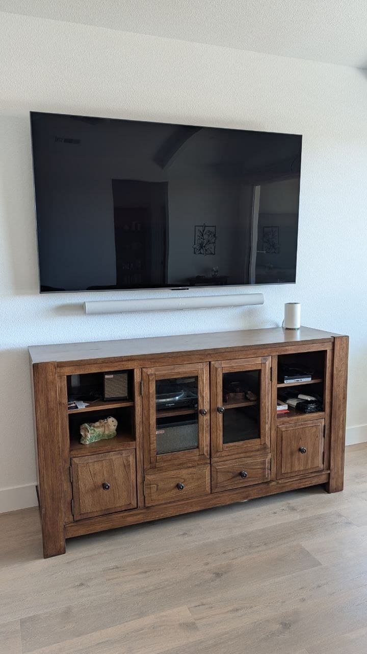 TV on Sanus advanced tilt mount with Sonos soundbar floating on wall below in Rancho Cordova, CA