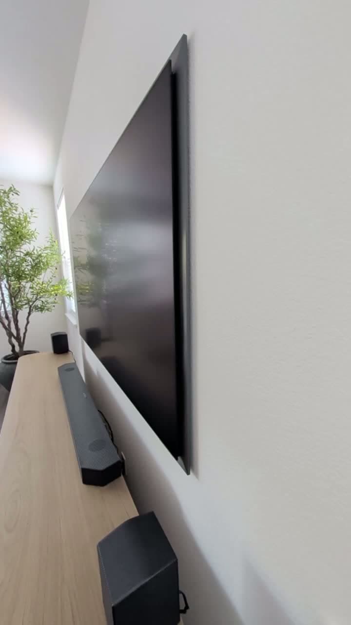 Profile view showing how flush Samsung S95F sits against wall with Samsung slim mount in Granite Bay, CA