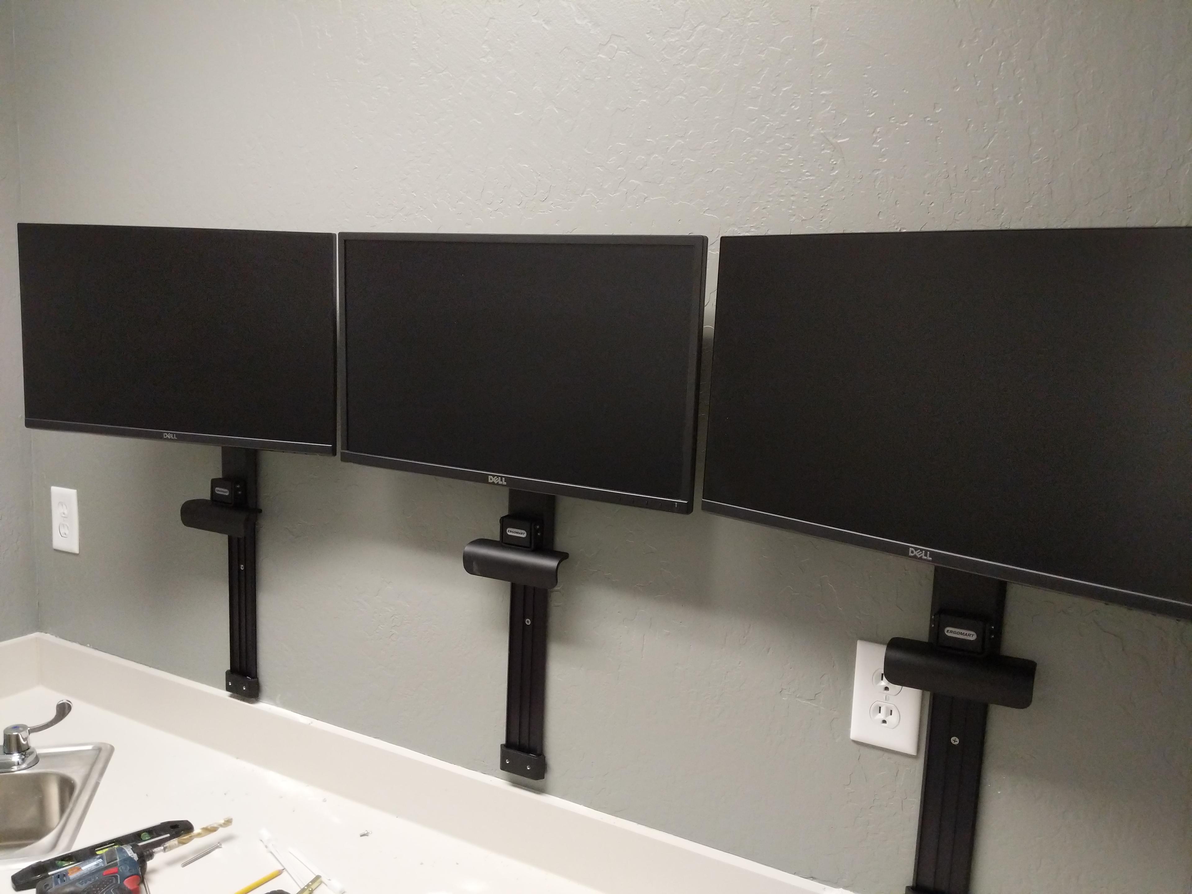 Triple monitor wall mount in office in Fair Oaks, CA