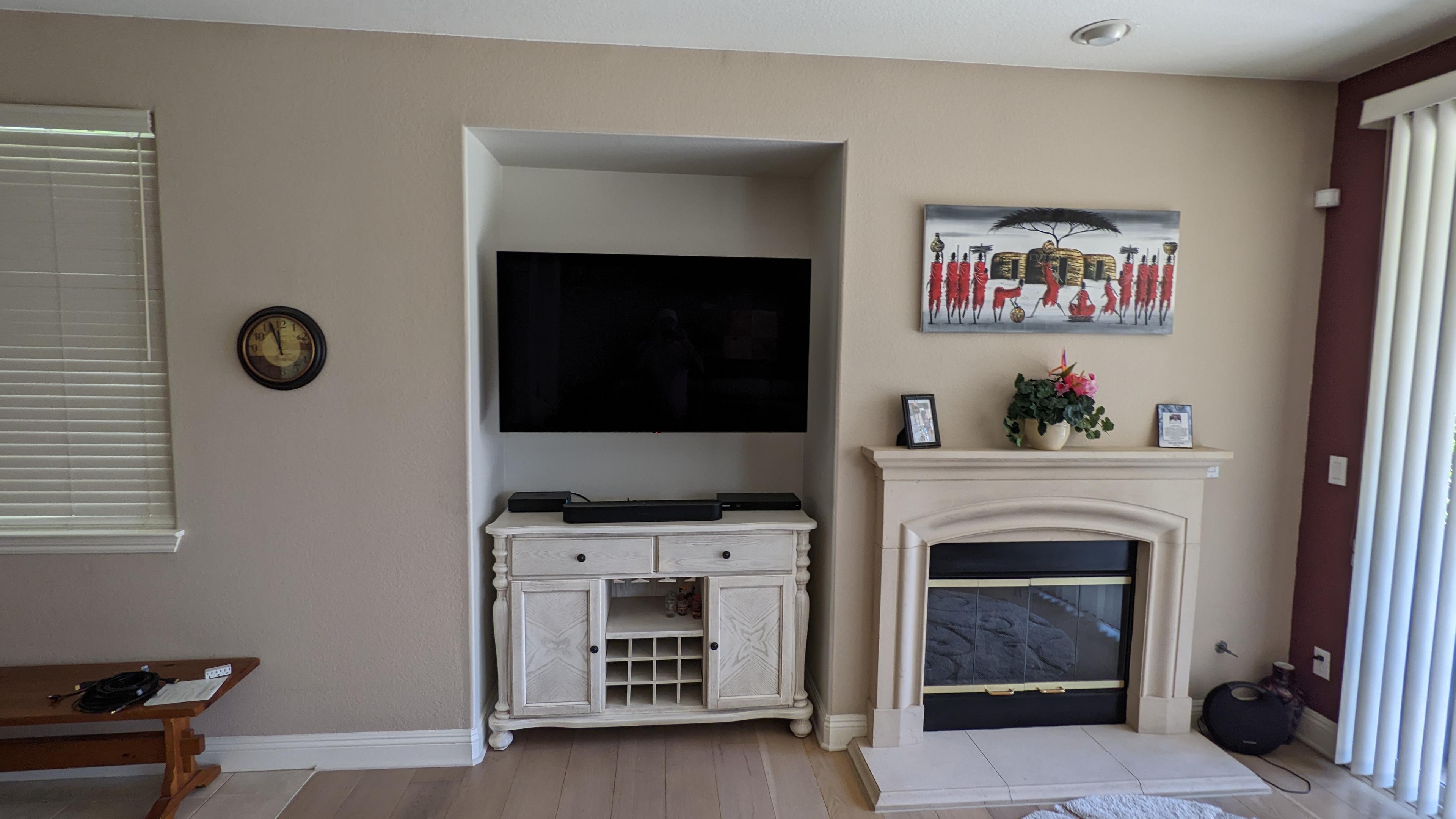 TV and soundbar in wall niche next to fireplace in Natomas, CA