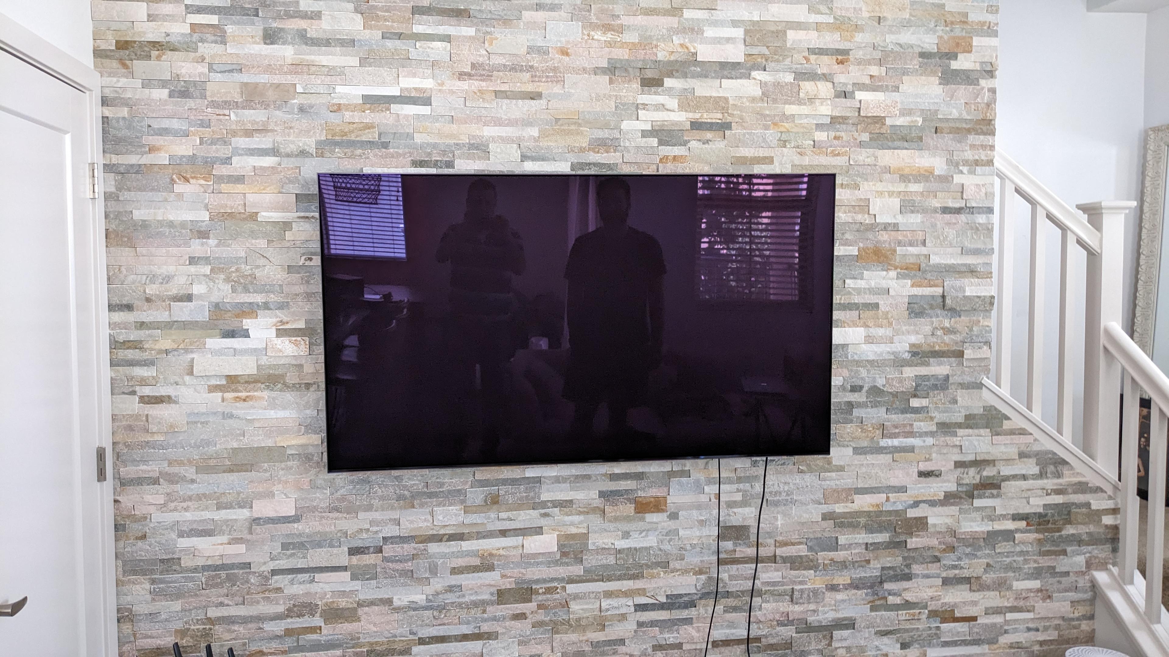 TV mounted on stacked stone accent wall in West Sacramento, CA
