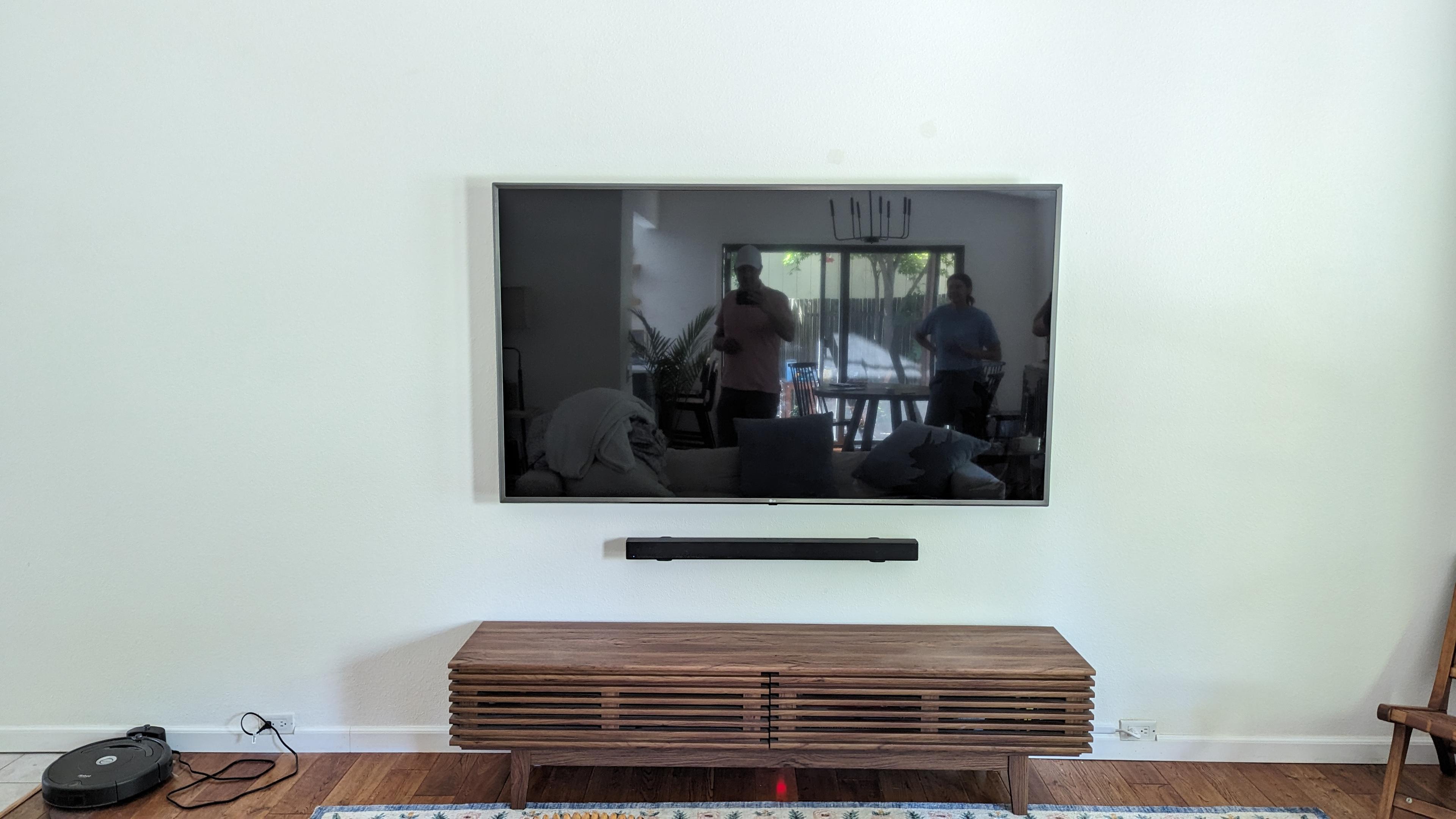 TV and soundbar above walnut console in Carmichael, CA