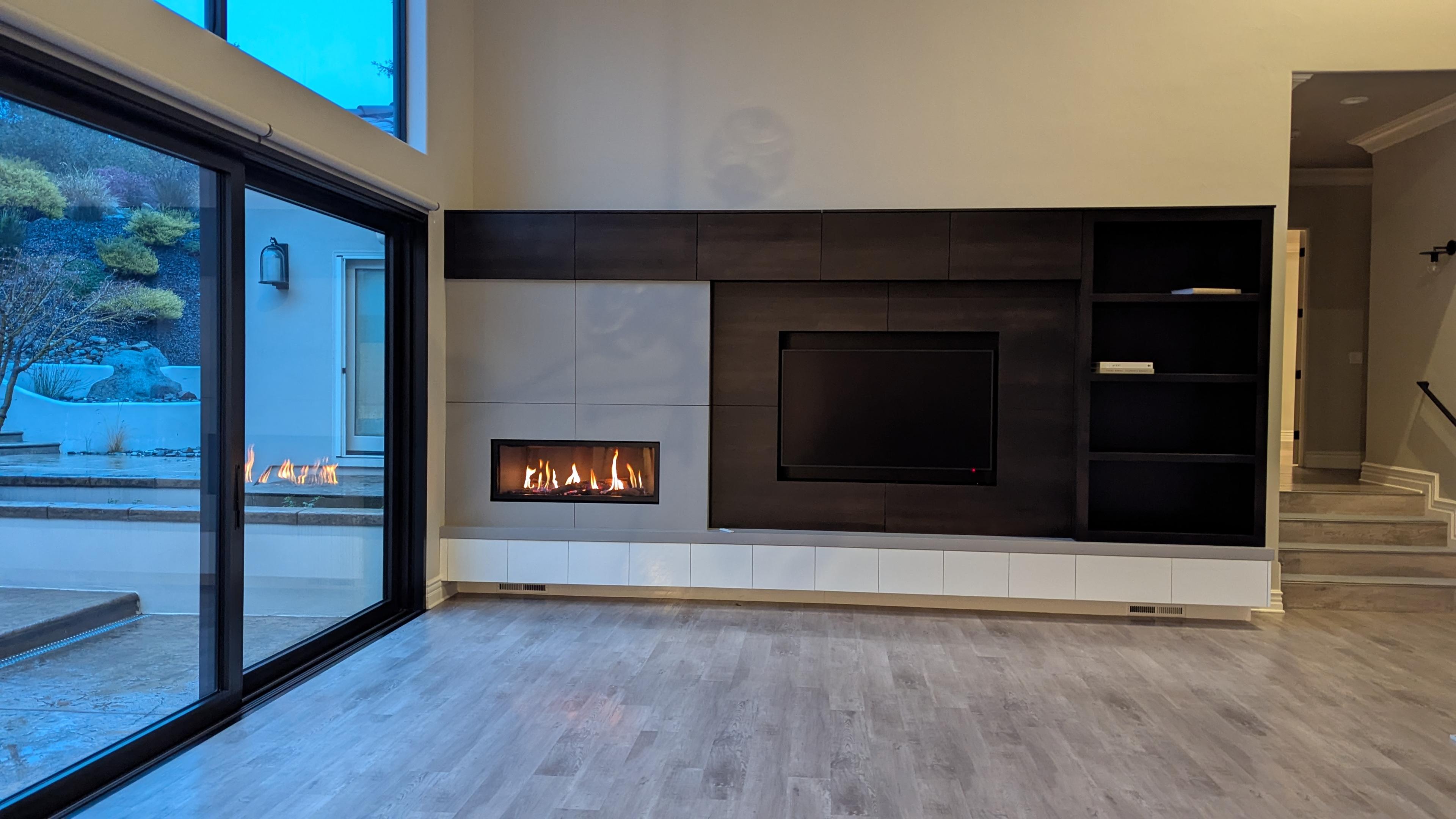 TV above modern media wall with electric fireplace in Loomis, CA