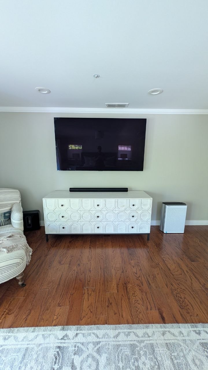 77-inch TV on full motion Sanus mount with Sonos soundbar and in-wall wires in Arden, CA