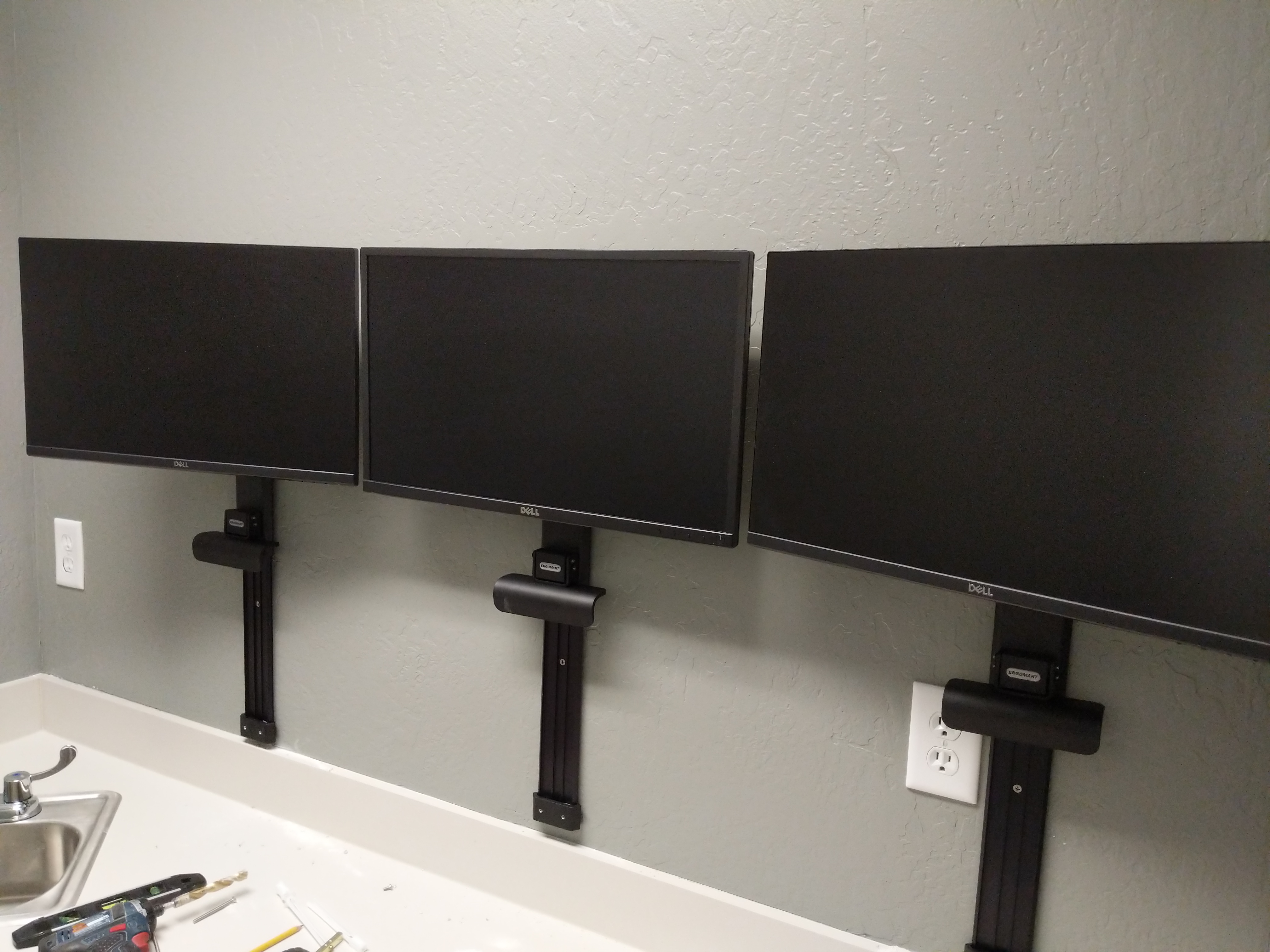 Triple monitor wall mount in office in Fair Oaks, CA