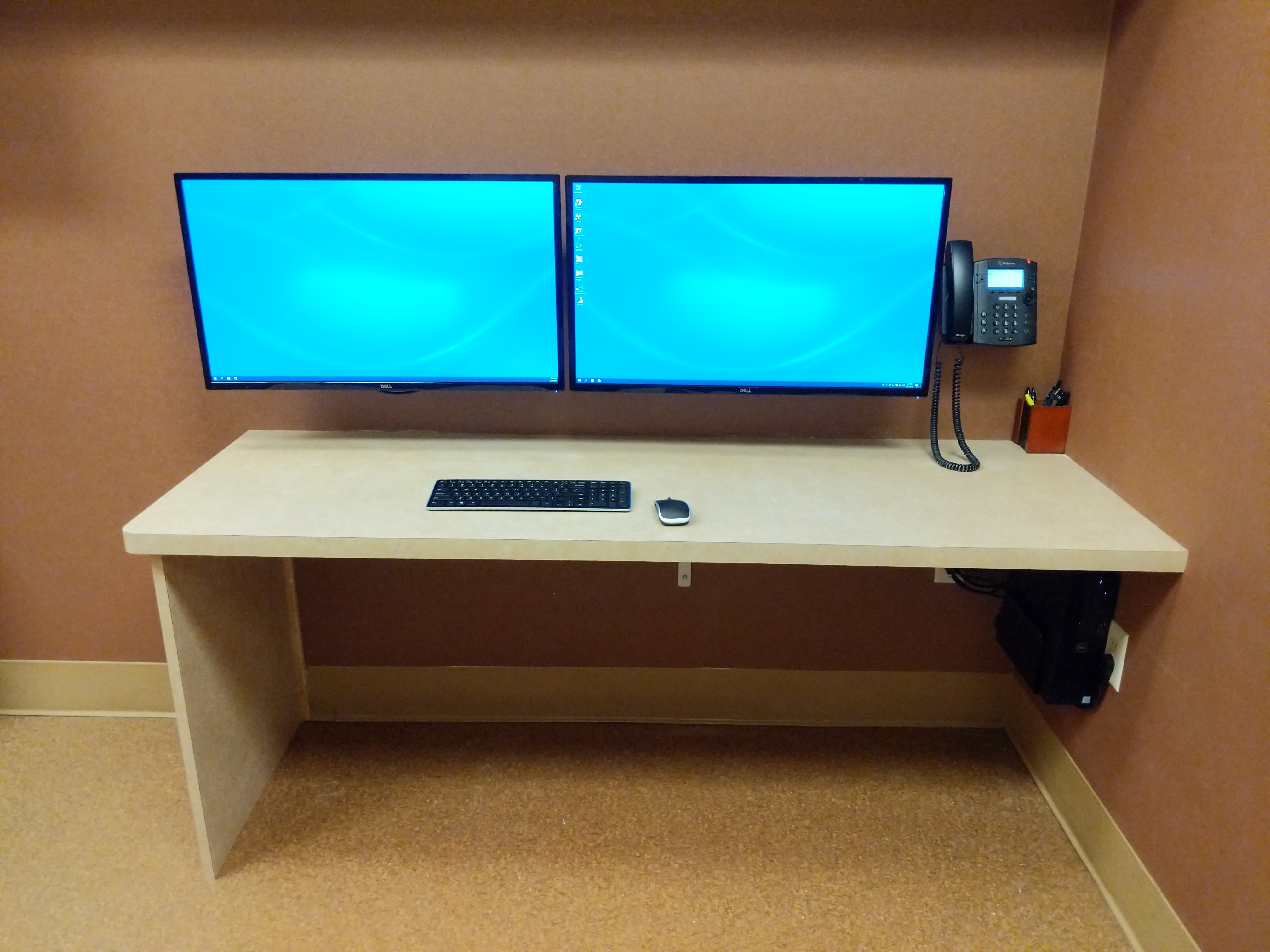 Dual monitor wall mount in office in Auburn, CA