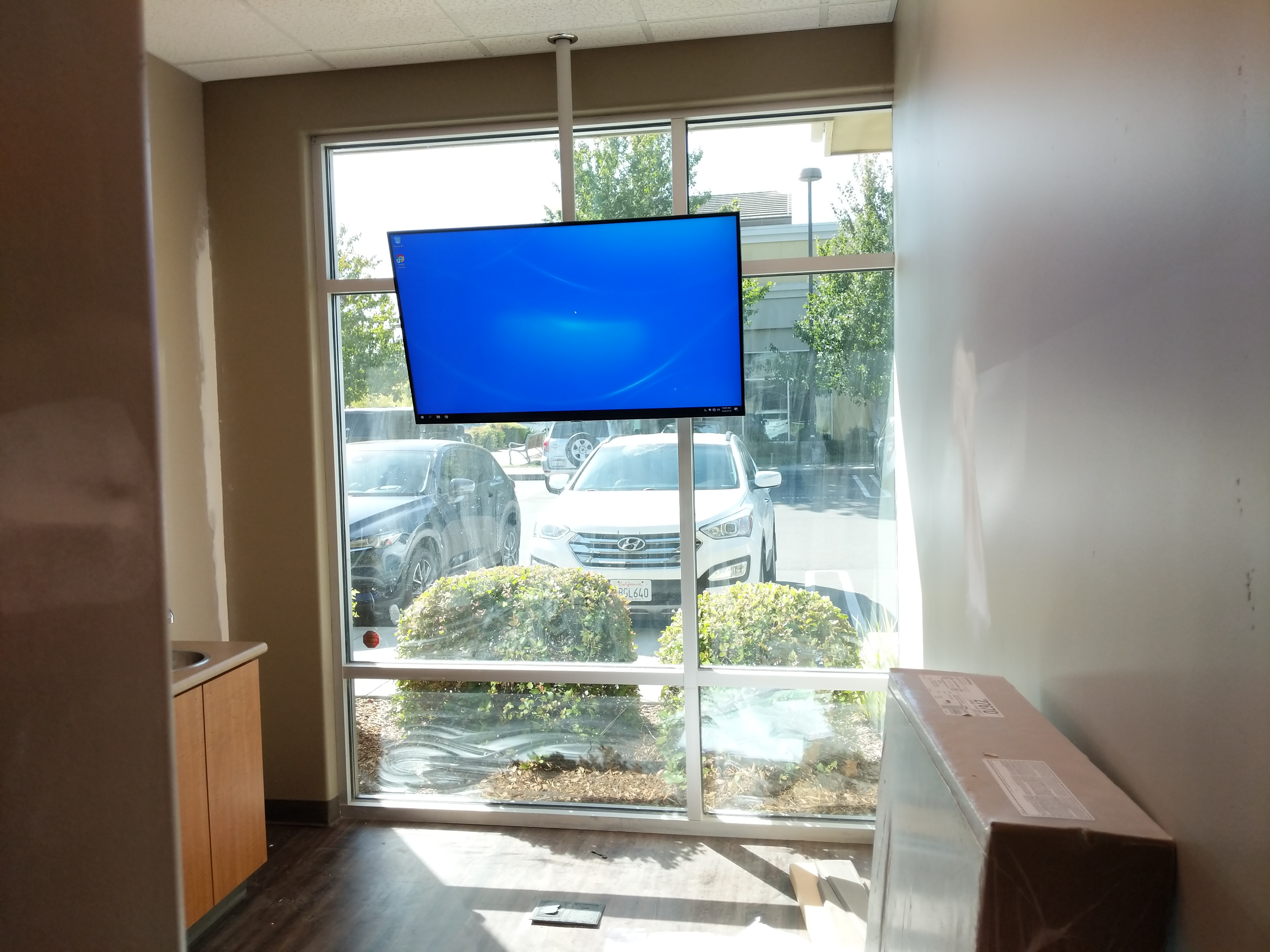 TV on ceiling pole mount in commercial space in Roseville, CA