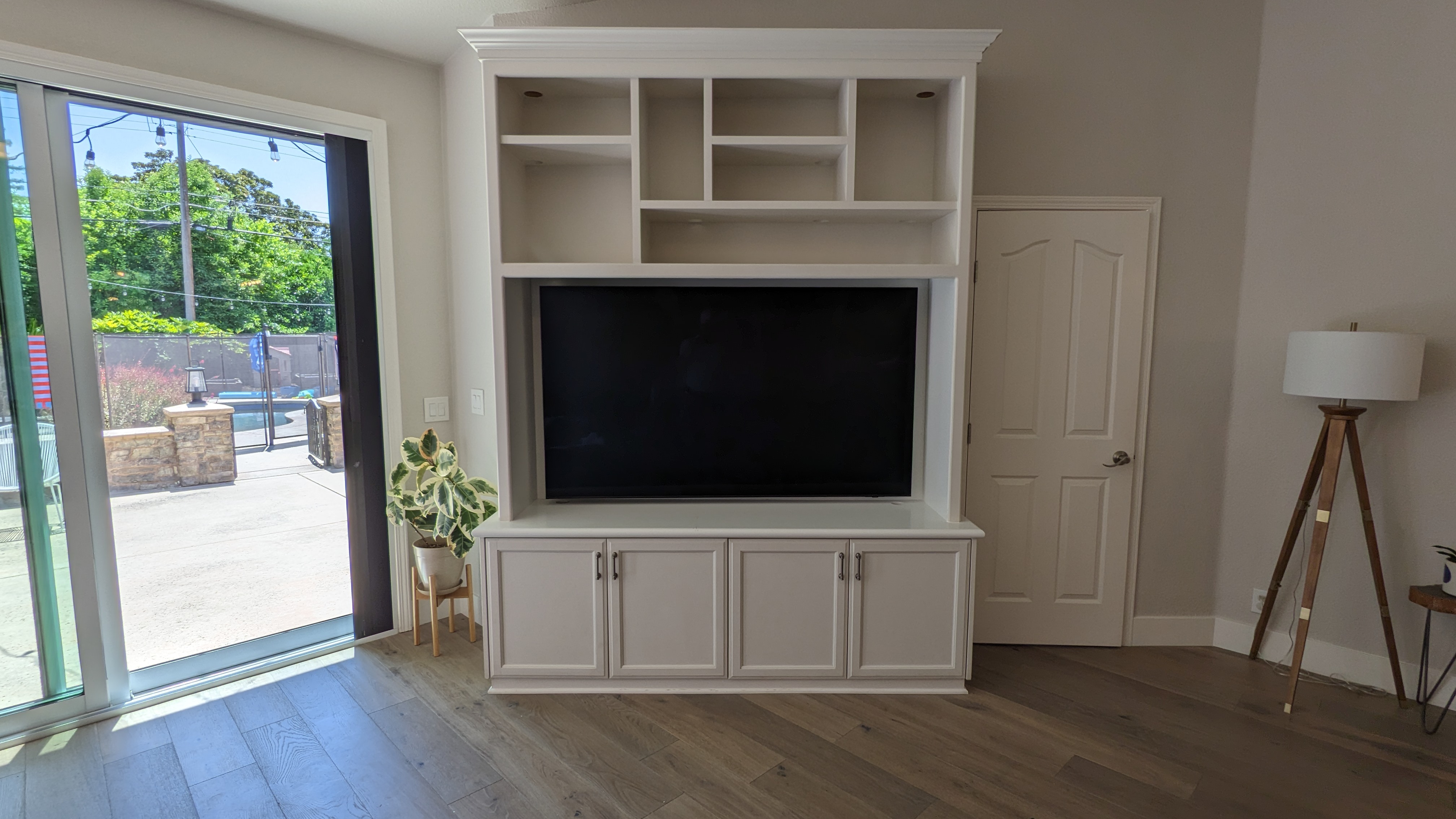 TV in white built-in entertainment center in Rancho Cordova, CA