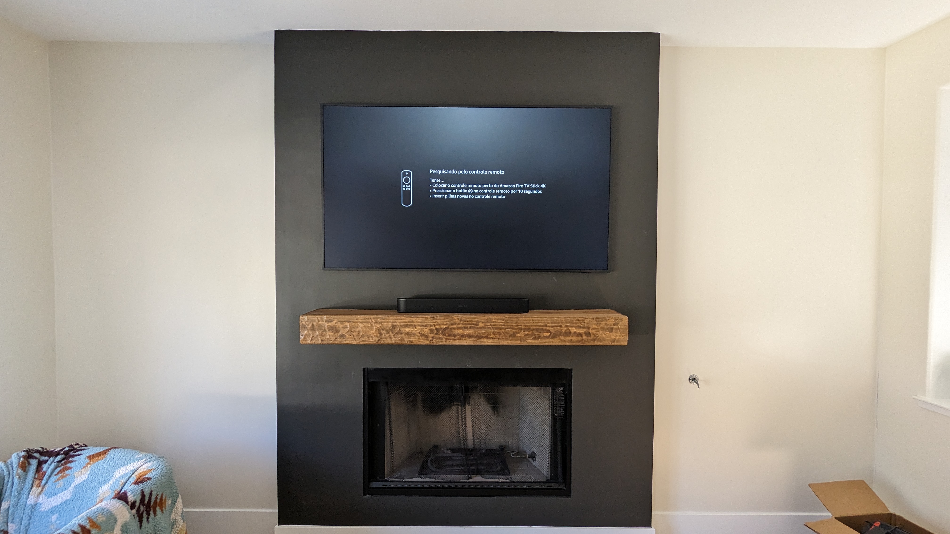 TV above fireplace with rustic wood mantel in Rocklin, CA