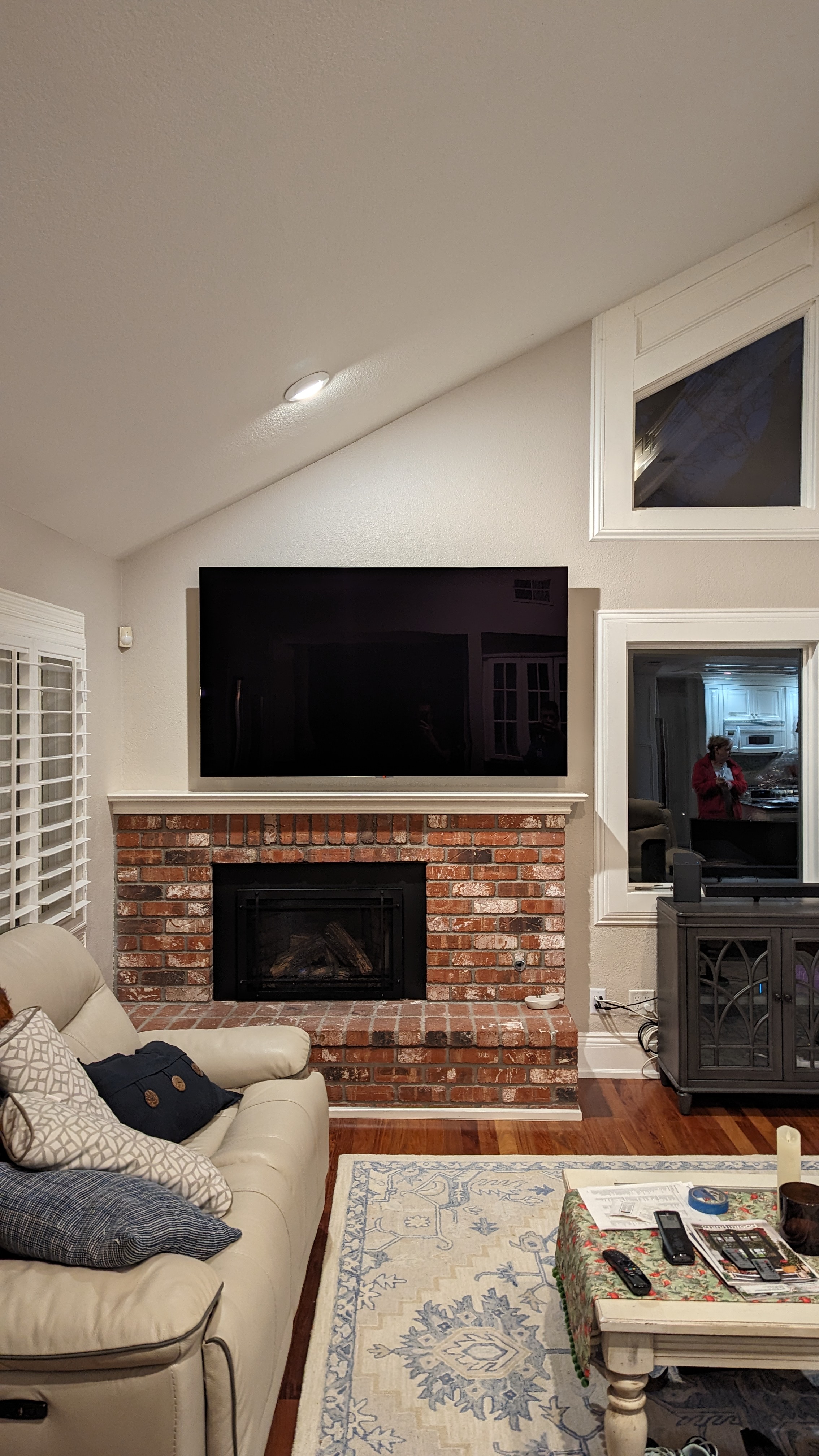 TV above brick fireplace in cozy living room in Orangevale, CA
