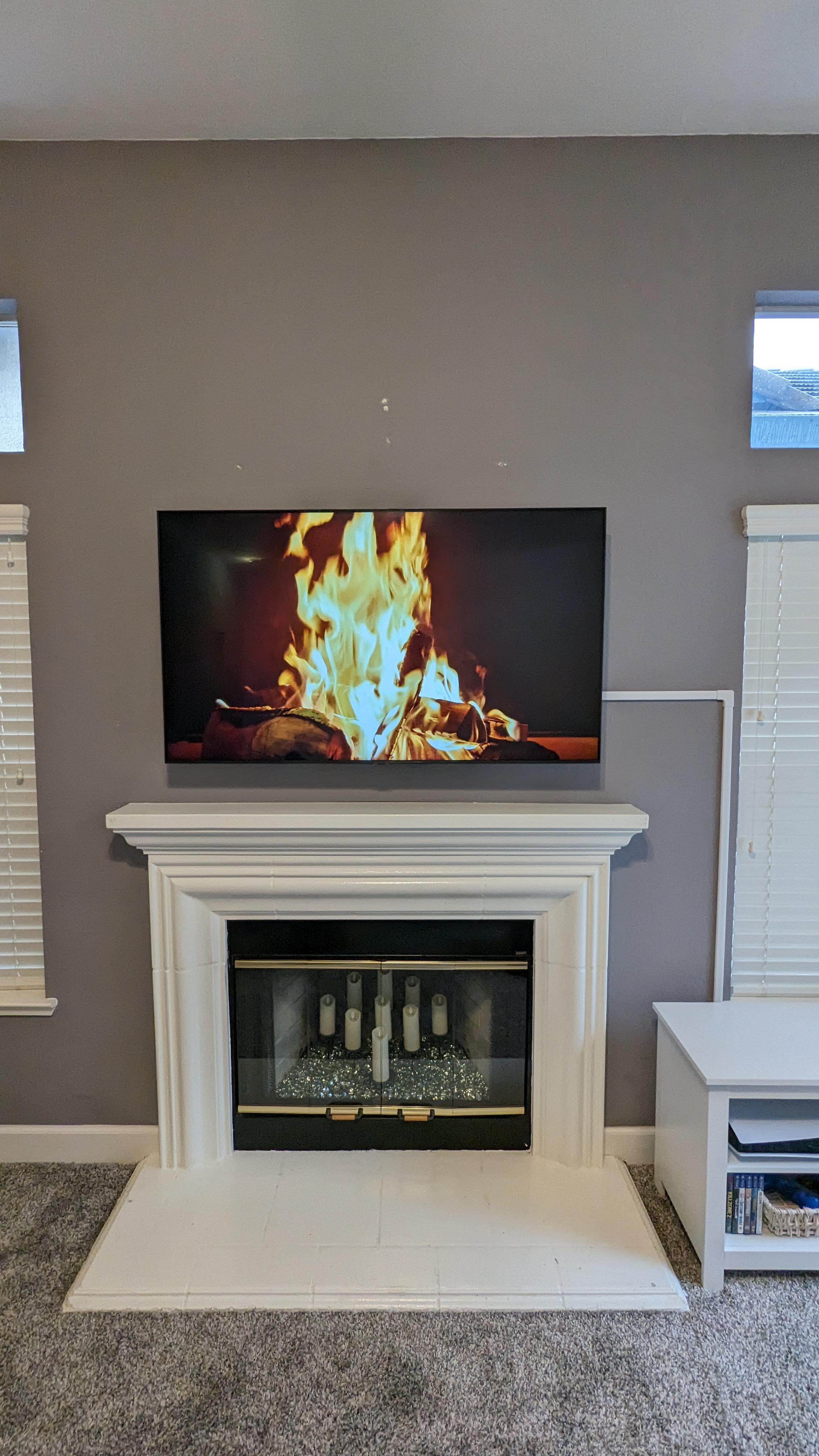TV above tile fireplace on gray accent wall in Citrus Heights, CA