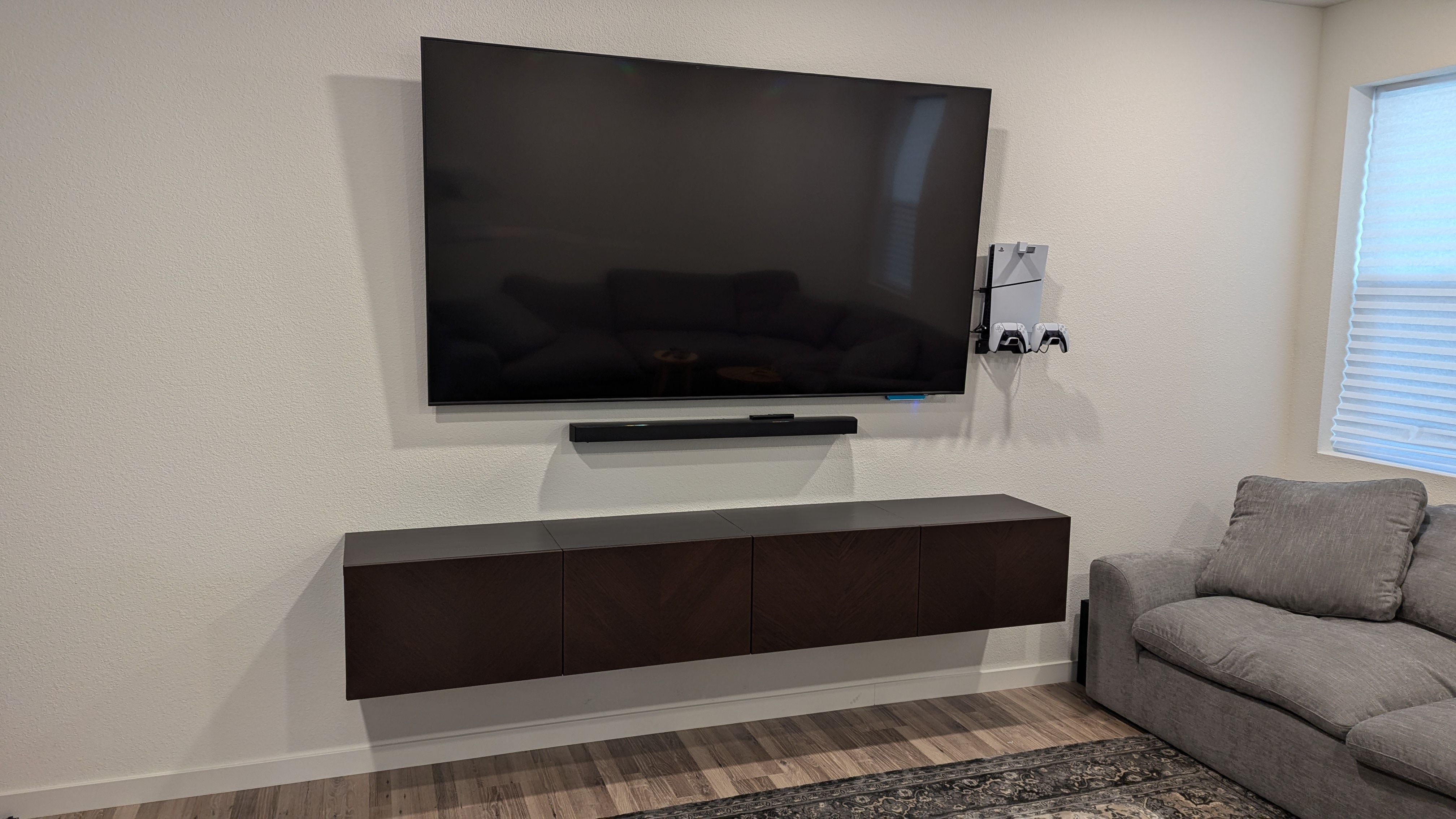 TV with soundbar and wall-mounted PS5 in West Sacramento, CA