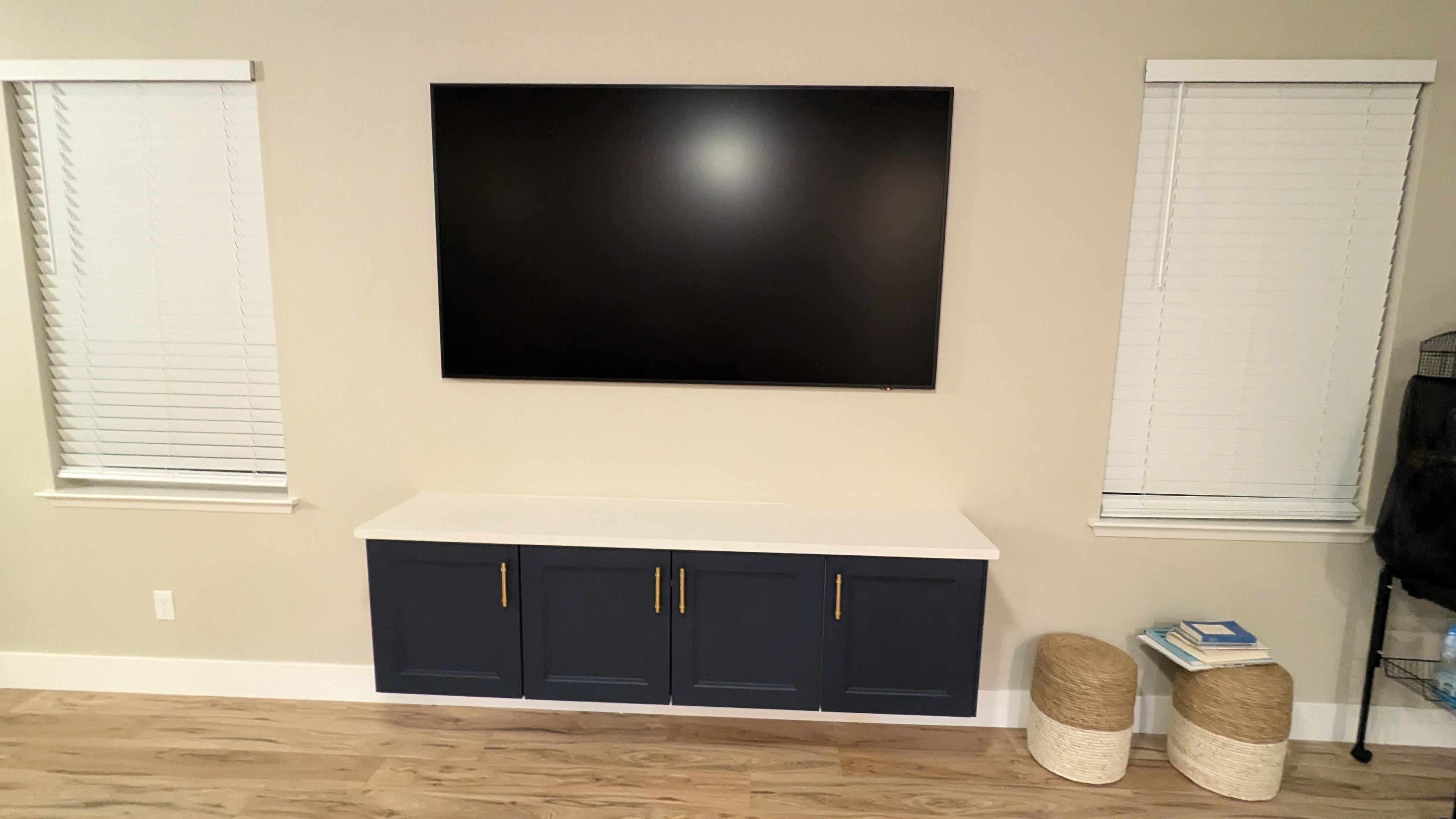 Samsung Frame TV above navy floating cabinet in West Sacramento, CA