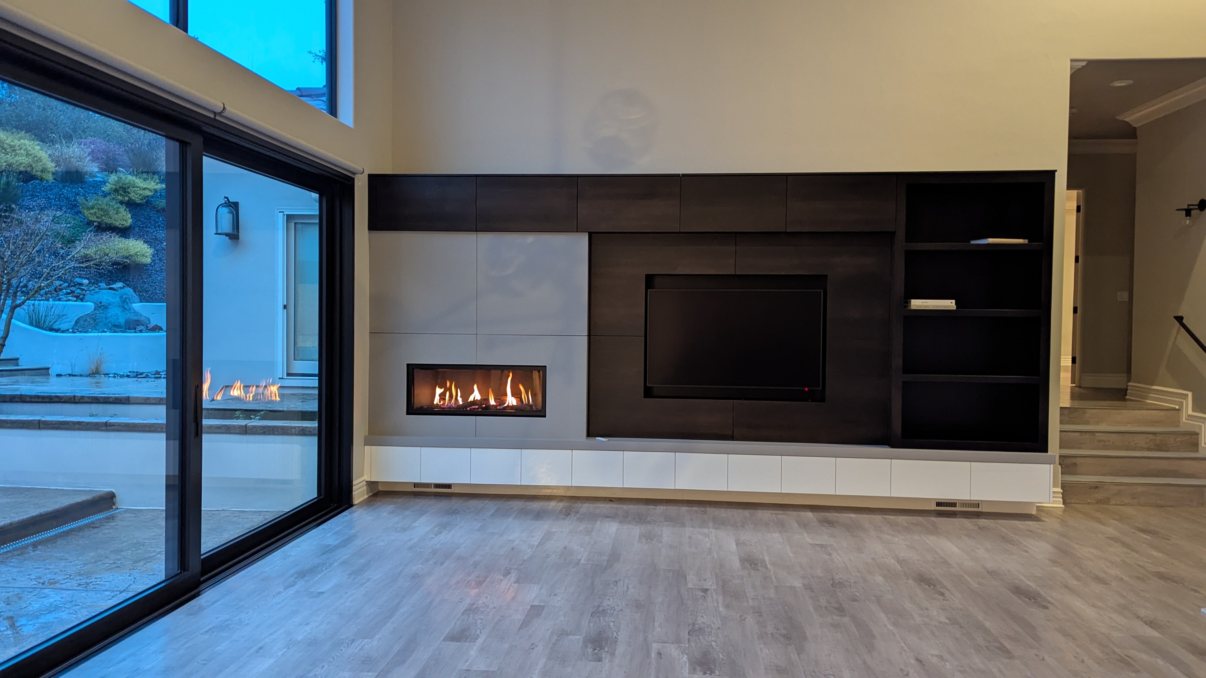 TV above modern media wall with electric fireplace in Loomis, CA