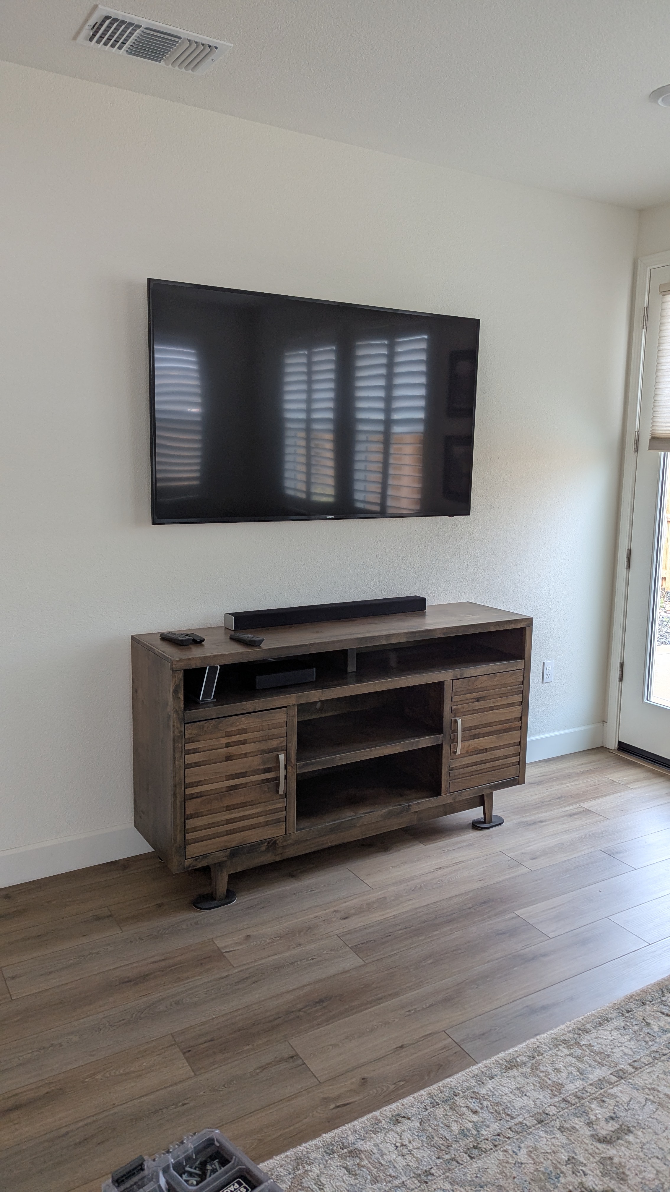 TV and soundbar above rustic console in Roseville, CA