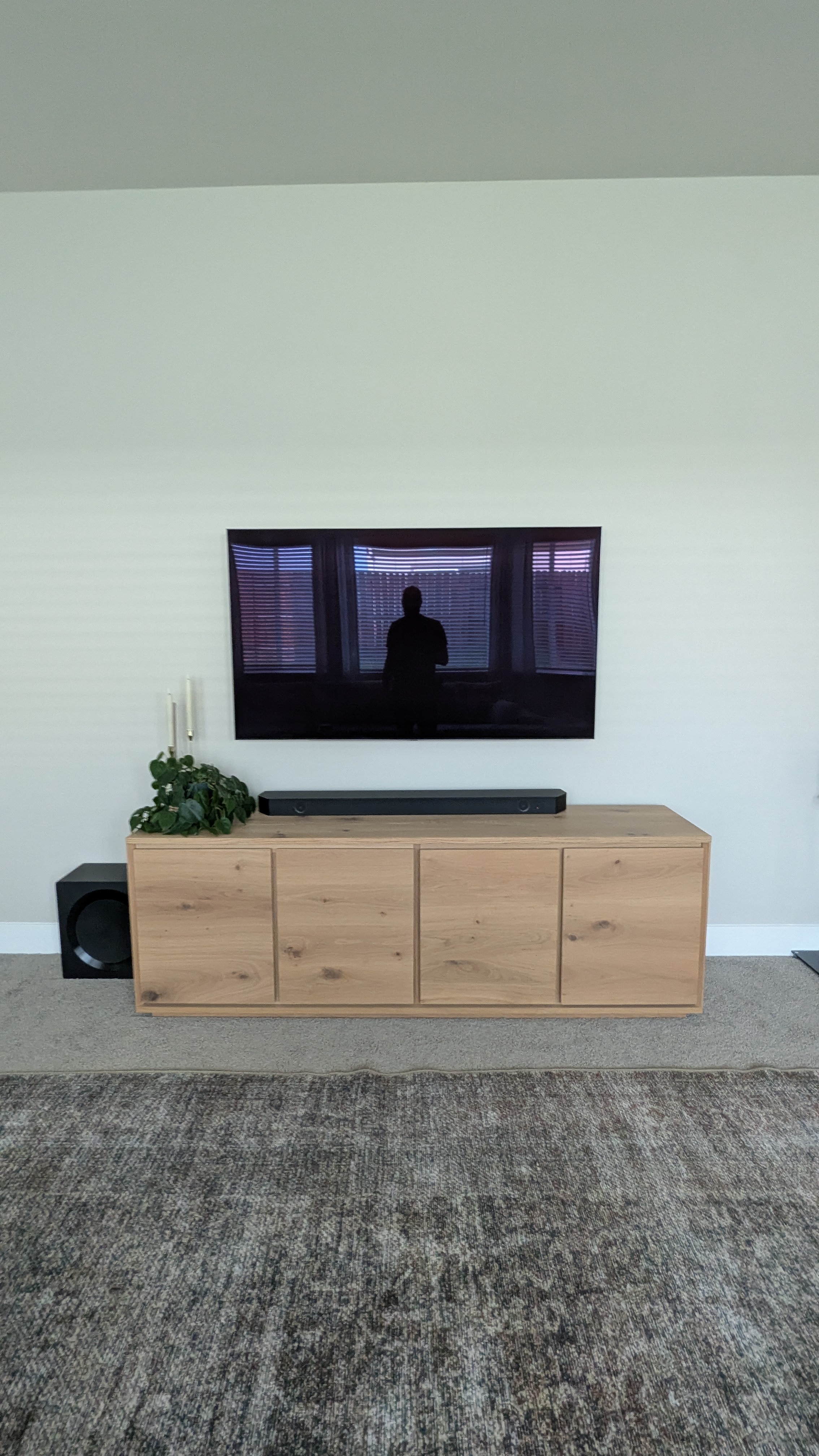 TV with soundbar above oak console in Fair Oaks, CA