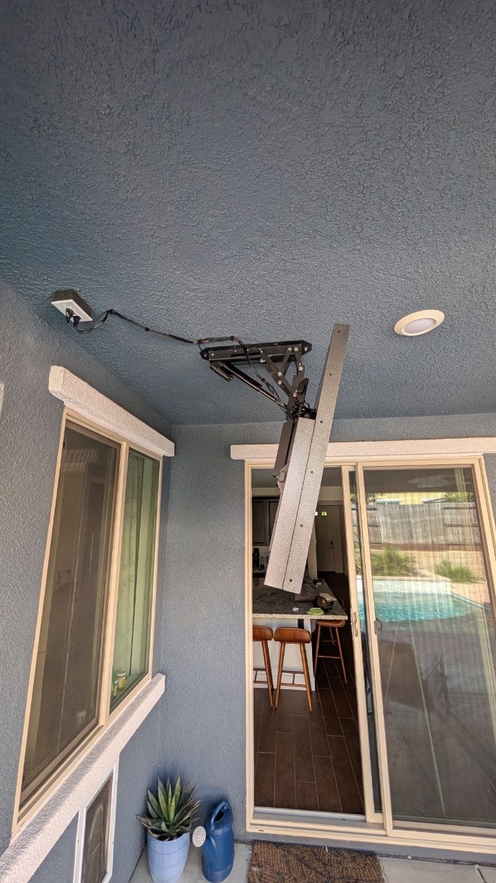 Fold-down mount stored in the up position on stucco covered patio in Rancho Cordova, CA