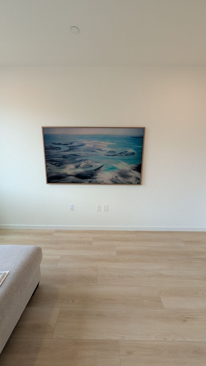 Samsung Frame Pro mounted on white wall in Elk Grove living room