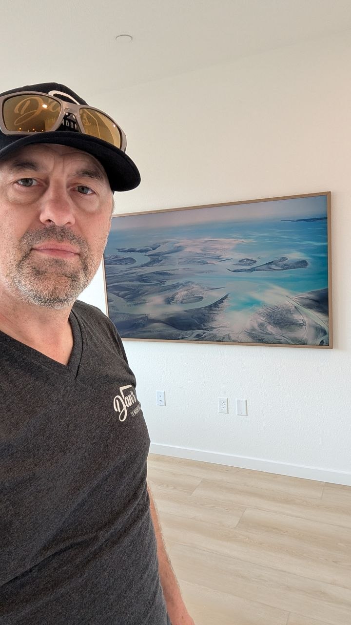 Dan with Samsung Frame Pro mounted on clean white wall in Elk Grove, CA