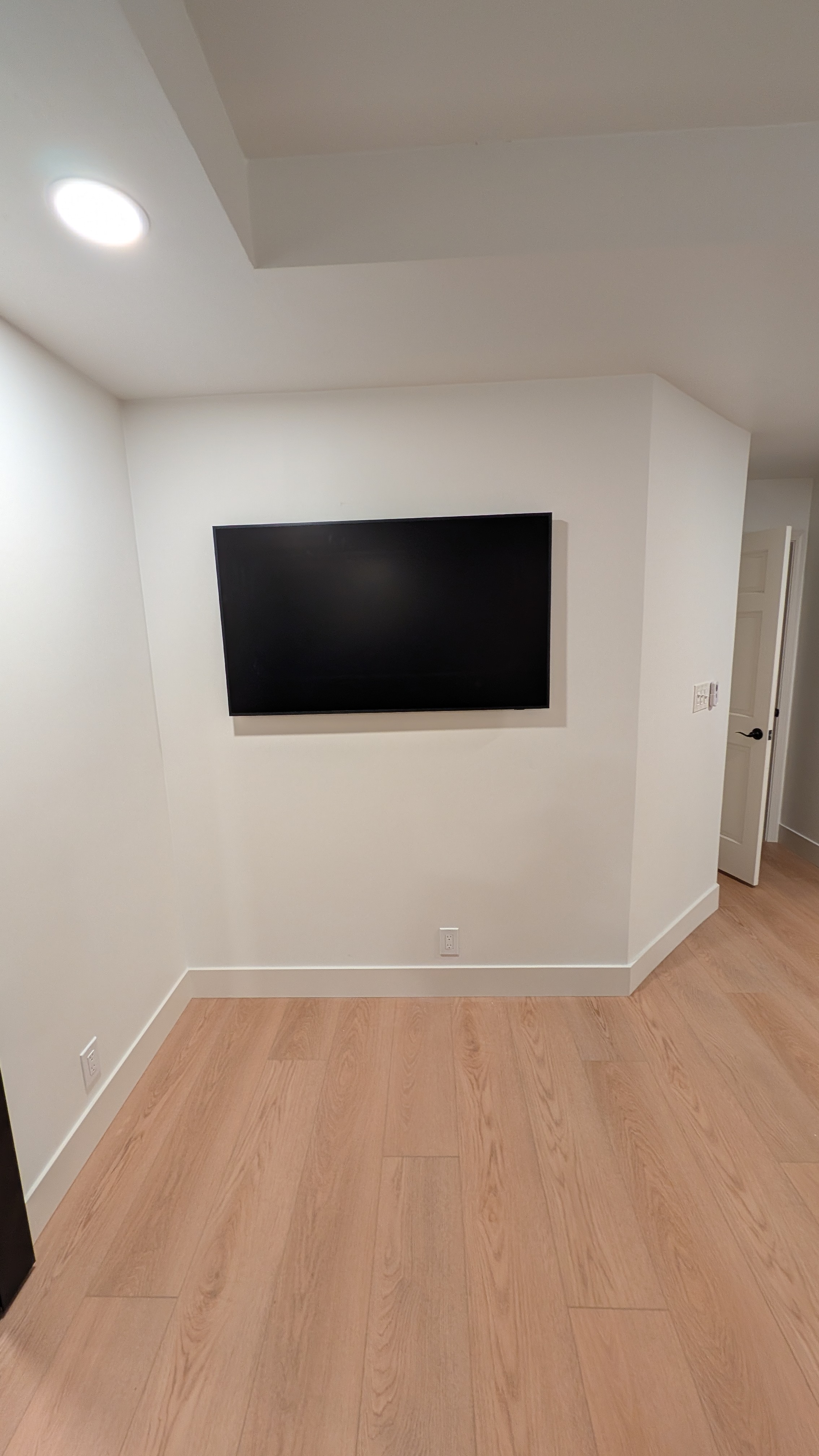 55-inch Samsung Frame TV mounted flush on white drywall in a Granite Bay, CA media room