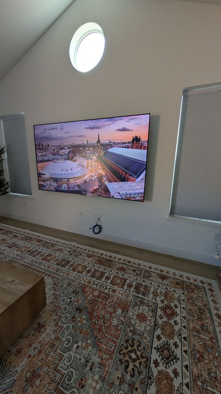98-inch TCL on Sanus advanced tilt mount in Rancho Cordova vaulted living room